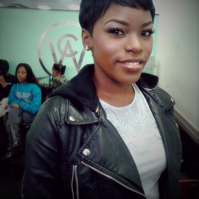 Clean, defined makeup with a short pixie cut